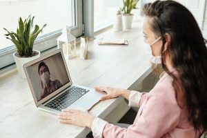 Woman video chatting with doctor